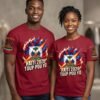 personalized burgundy red crewneck t-shirts featuring a stylized "Haiti 2026" graphic with a flaming Haitian flag.